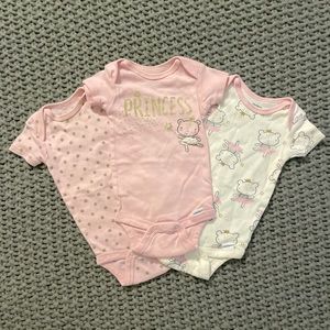Set of three baby girl onesies in the size 3-6 months
